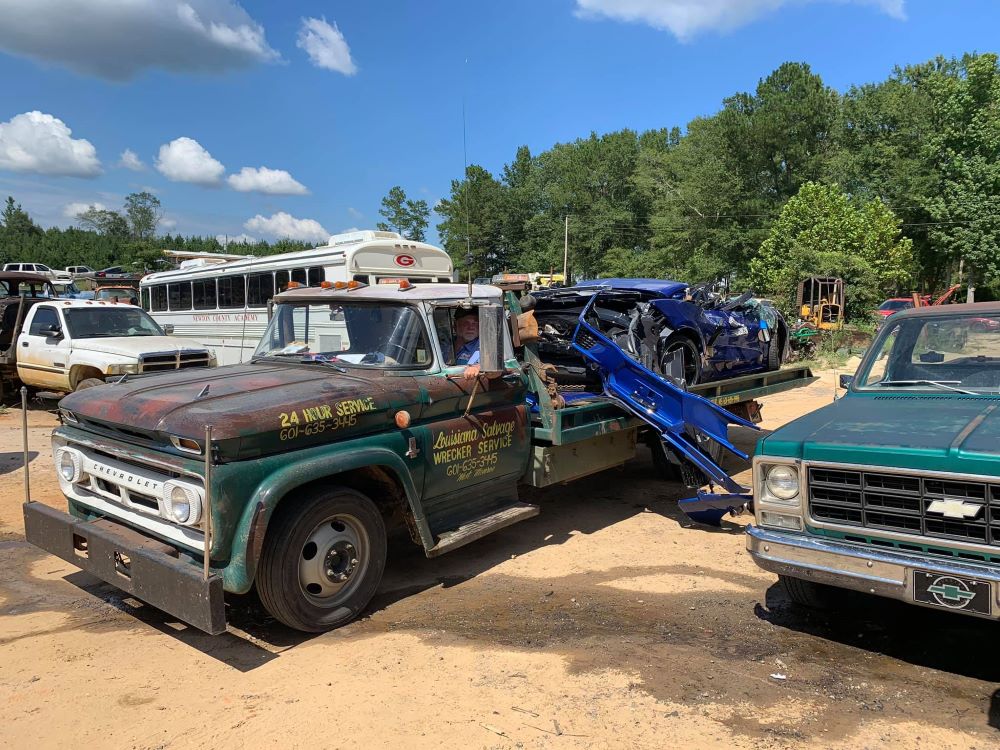 Wrecked C8 Corvette on Chevy C50 Flatbed