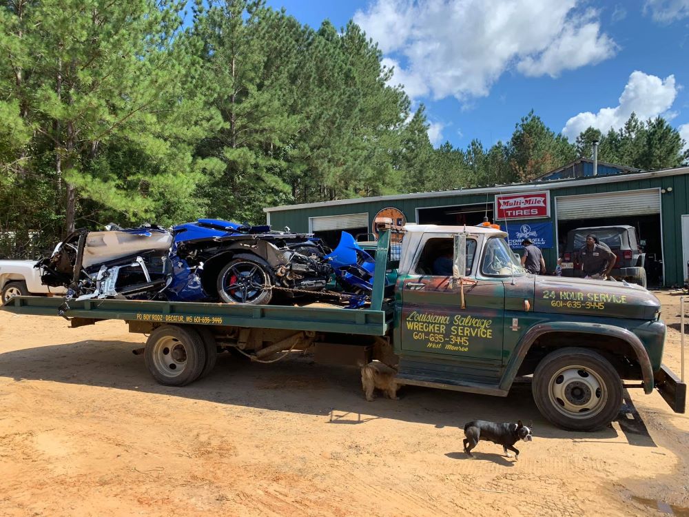 Wrecked C8 Corvette on Chevy C50 Flatbed