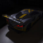 Overhead view of rear three-quarter on 2024 Chevrolet Corvette Z06 GT3.R in spotlight. Pre-production model shown. Actual production model may vary. Model year 2024 Corvette Z06 GT3.R will be available later this year.