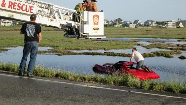 C3-Corvette-Crashes-Into-Marsh- text image