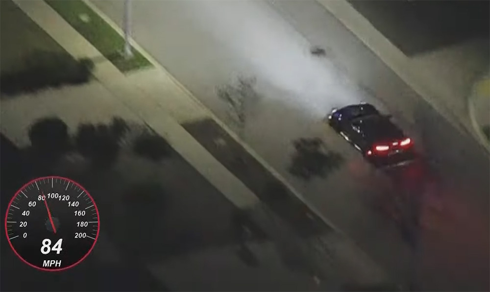 C7 Corvette speeding through city streets during police chase