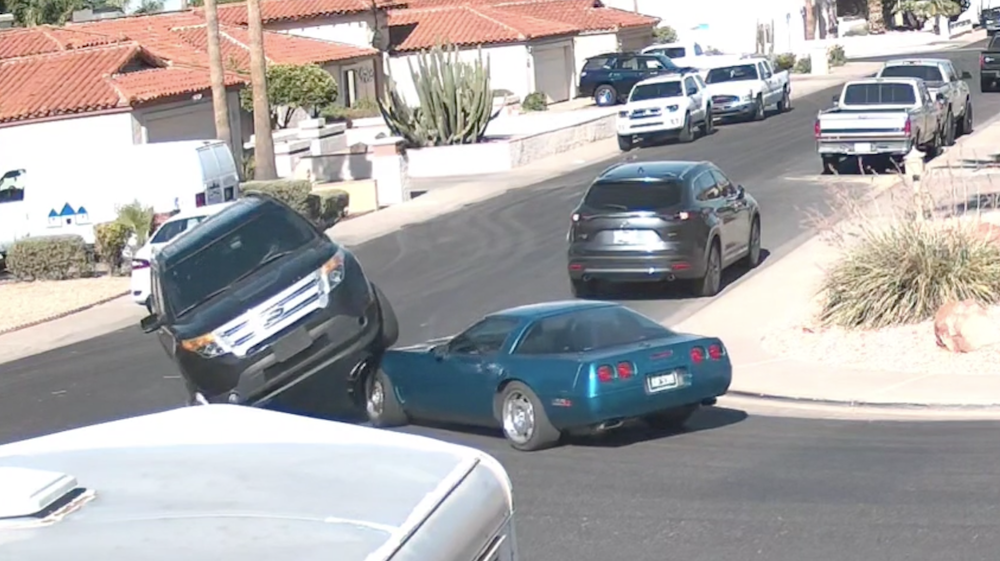 Ford Explorer Drives Over C4 Corvette