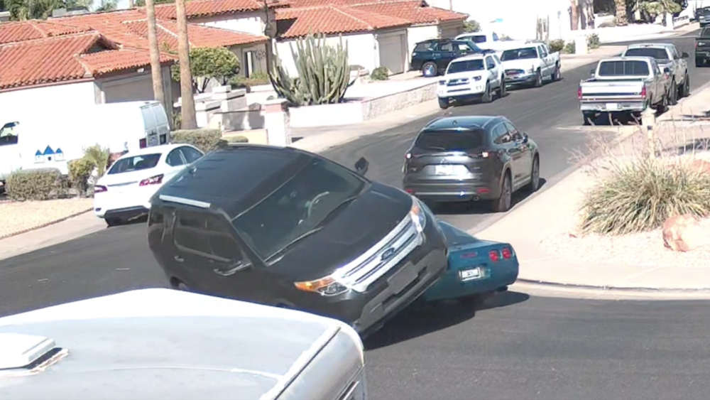 Ford Explorer Drives Over C4 Corvette